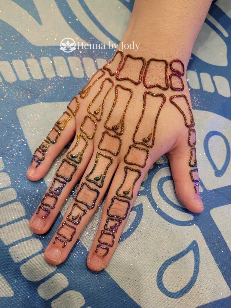 Skeleton hand henna for Halloween themed events.