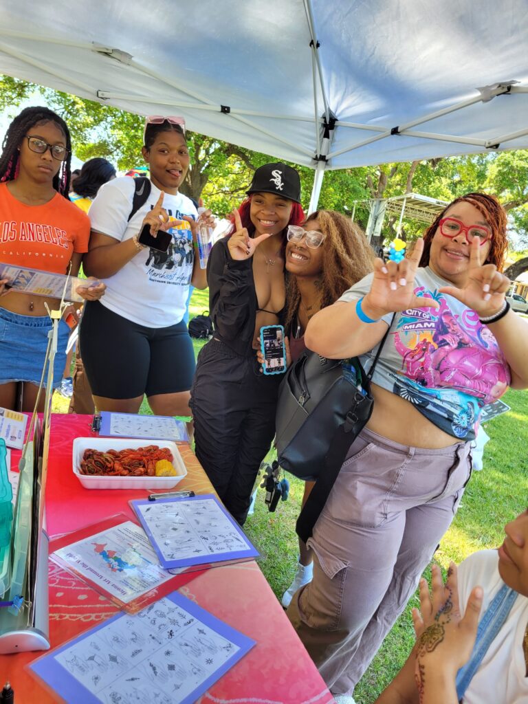 Excited students in the henna line on campus